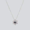 A silver six-pointed star pendant necklace with a dark blue center stone, displayed on a black velvet jewelry box with white text reading 'six-pointed Star Love'.